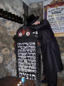 כ
