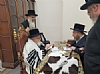 אצל כ