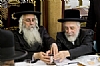 Liska Rebbe lifts becher as his brother, the Hivneve Rebbe benches